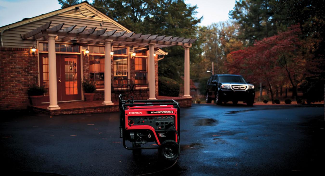 Red Honda generator outside a house