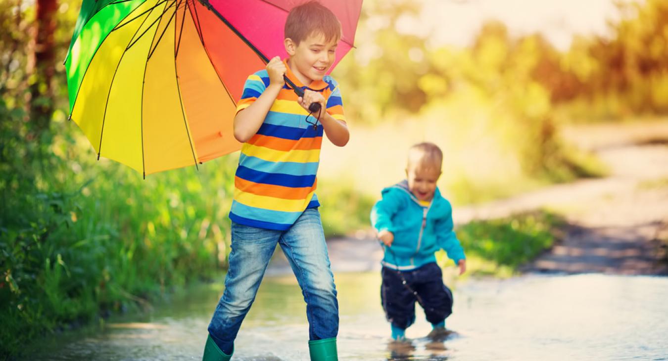 boys playing in flooded street